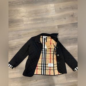 New never worn tagged Burberry quilted jacket.